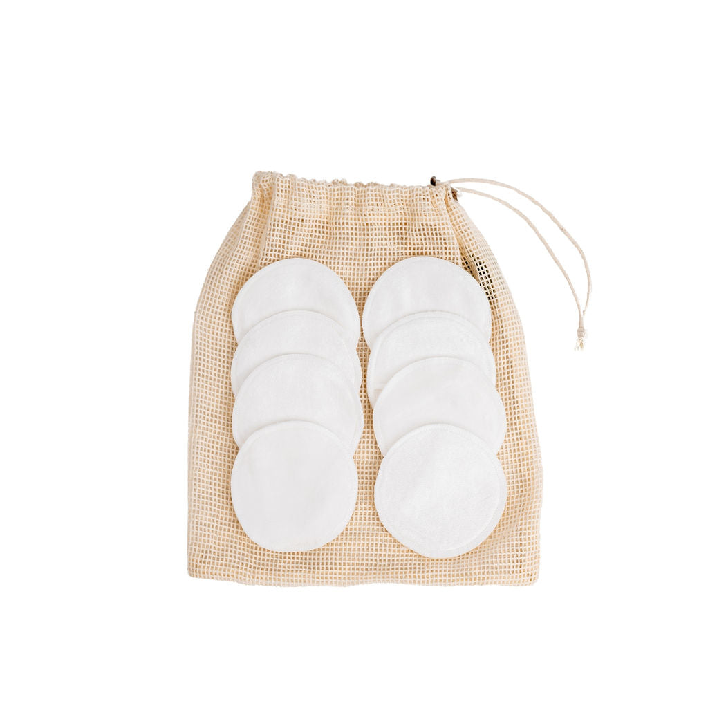 Australian made Selkia reuse-able bamboo velvet face pads placed on the Selkia mesh wash bag on white background