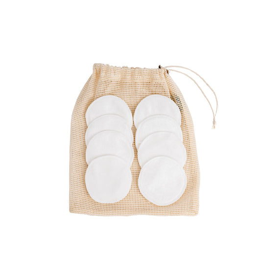 Australian made Selkia reuse-able bamboo velvet face pads placed on the Selkia mesh wash bag on white background