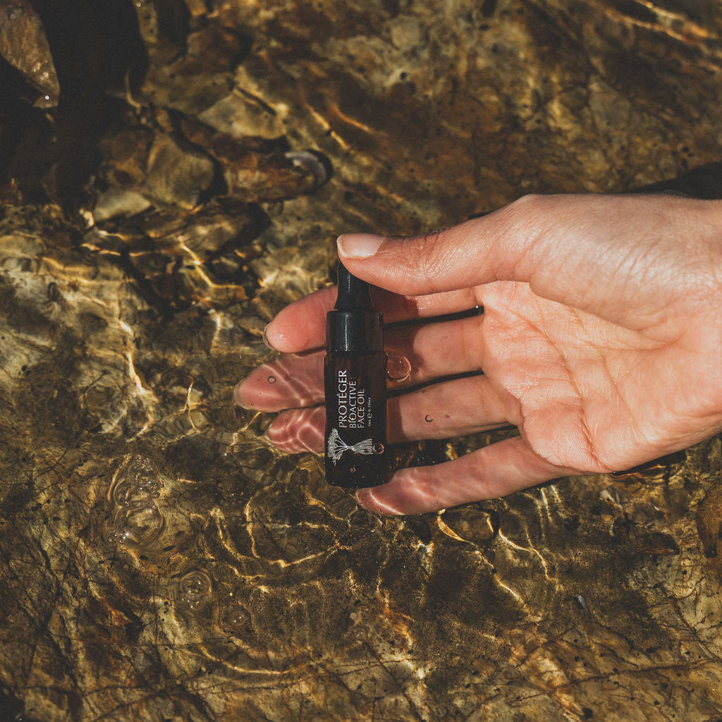 dreamy photo of the face oil in the water