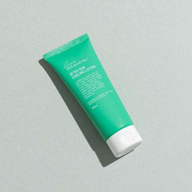 Green tube of after sun cooling lotion on a gray background