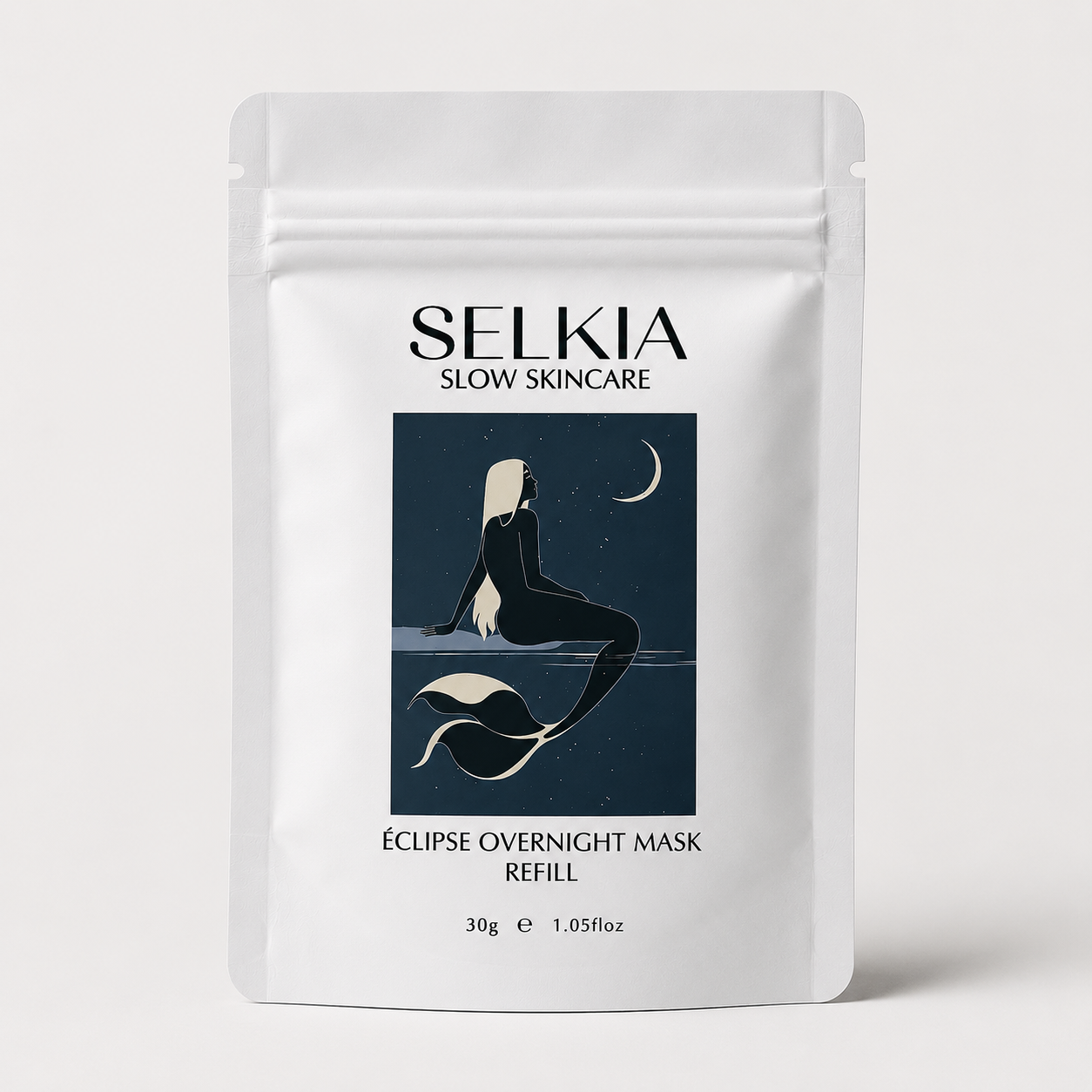 A white stand-up pouch of SELKIA Slow Skincare Eclipse Overnight Mask Refill, featuring a dark blue graphic of a mermaid and moon on the front, set against a light gray background.